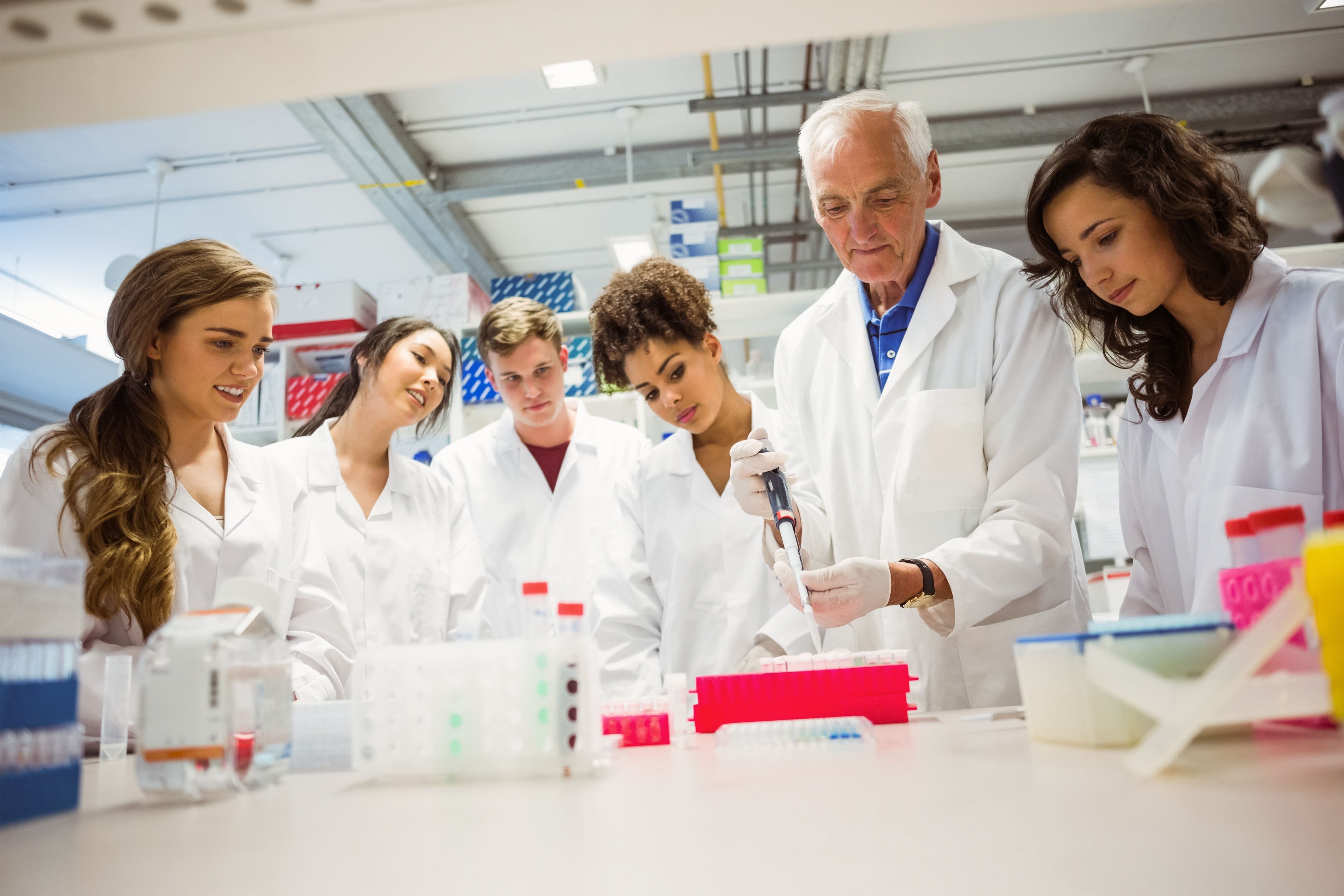 Students and a teacher in a life science classroom